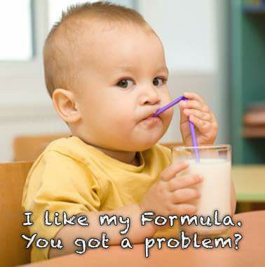 A baby drinking milk from a straw with the caption i like my formula, you got a problem.