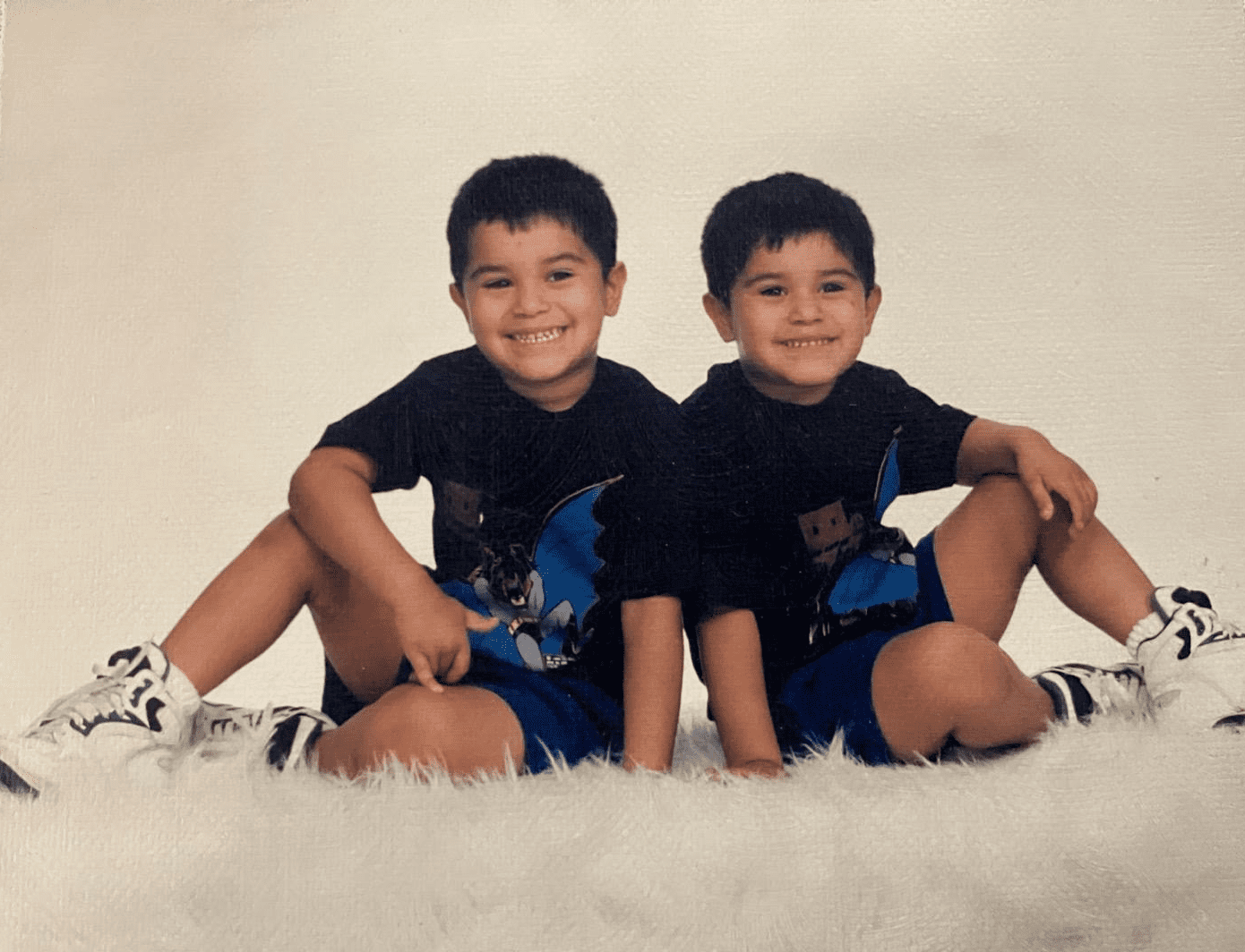 Two boys posing for a photo.