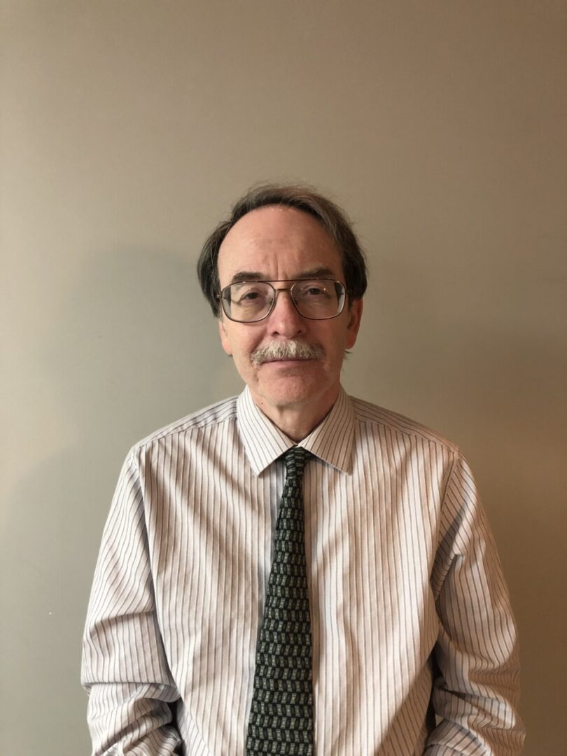 A man in a striped shirt and tie.