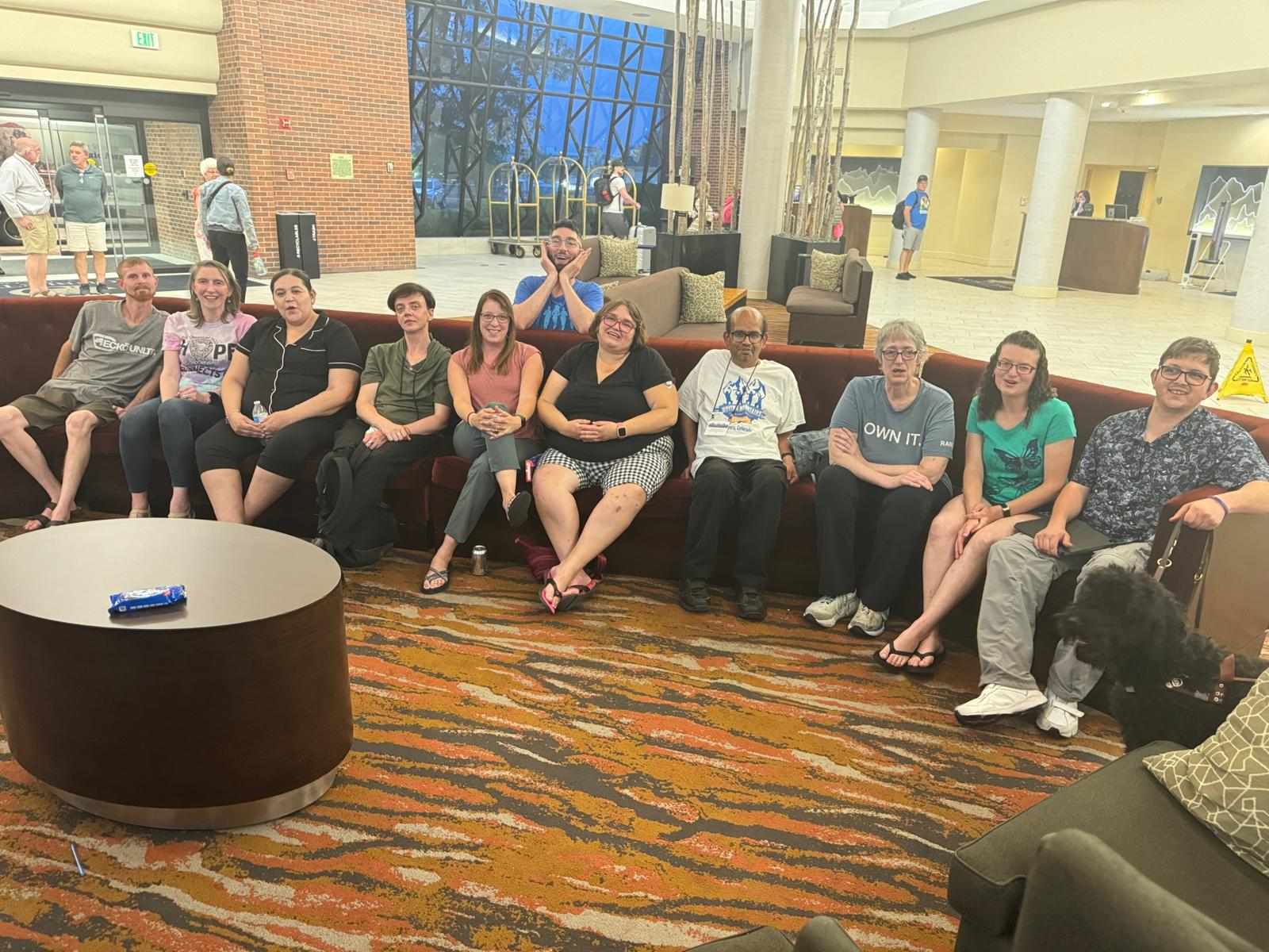 Group of people sitting on a couch.